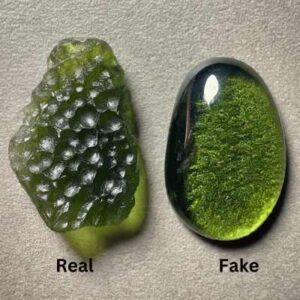 A side-by-side close-up photo of an authentic Moldavite with its characteristic texture, and a glass imitation with a smoother surface.